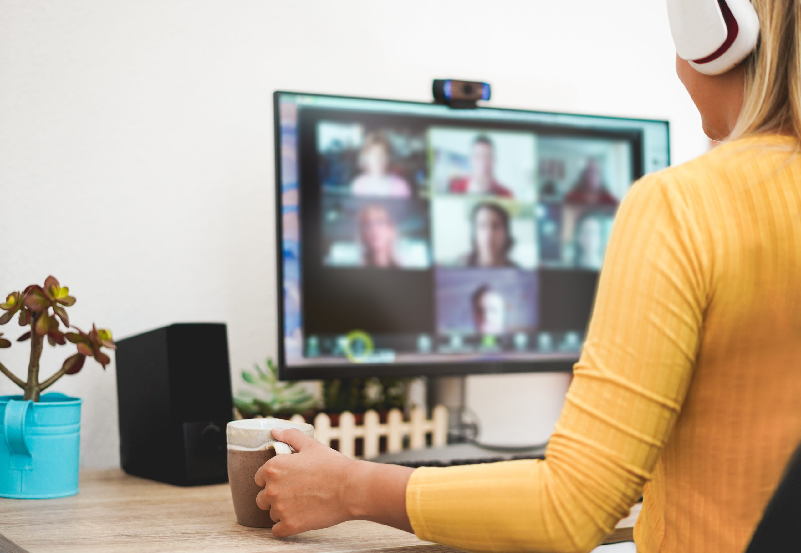 Young woman having a discussion meeting in video call with her team - Girl having chatting with friends on computer web app - Technology and smart work concept - Focus on hand